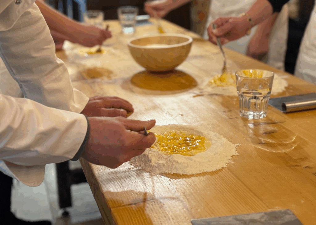 A small group enjoys a private cooking lesson with a local chef, learning to prepare a traditional family recipe
